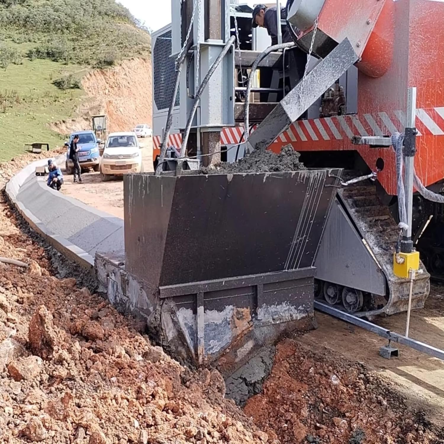 automatic slipform curb paver,best slipform curb paver,slipform curb paver pros cons,stringless curb and gutter machine,GPS ready concrete curb machine,should I buy a slipform curb paver performance testing and real-world results